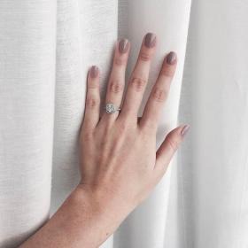 Cushion-cut diamond engagement ring on point