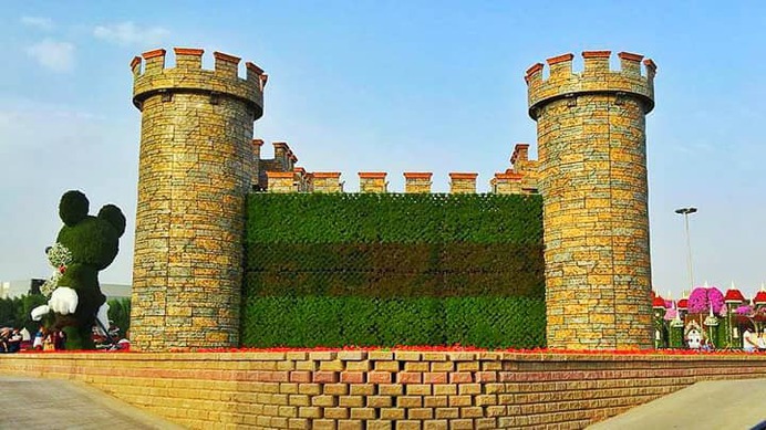 Floral fort has a height of almost 20 feet and width of almost 30 feet long. Floral fort grows flowers and shrubs all over it.