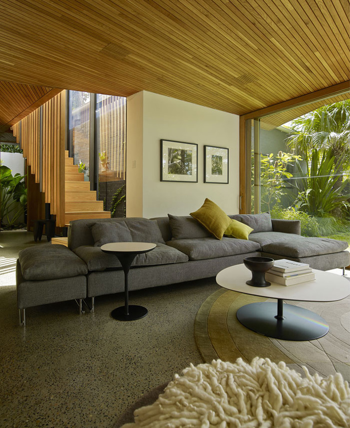 Cottage With a Series of Indoor and Outdoor Spaces