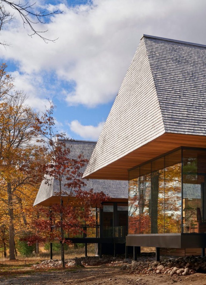 Massive hip roofs top Ontario cabins by MacKay-Lyons Sweetapple