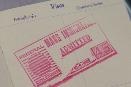 Figure 3.3 Visa stamp, with what appears to be a mistakenly used version of the Federal Colonies logo without its two moons.