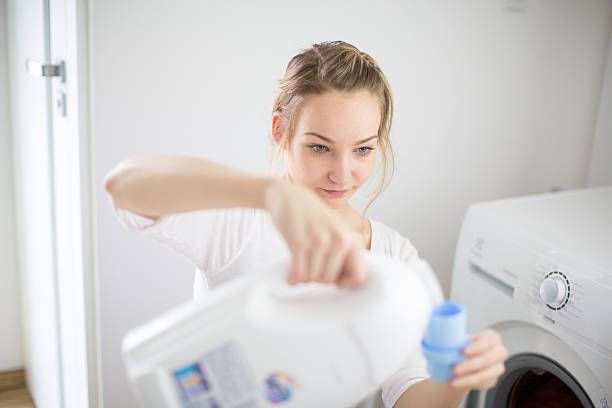 Young woman doing laundry
