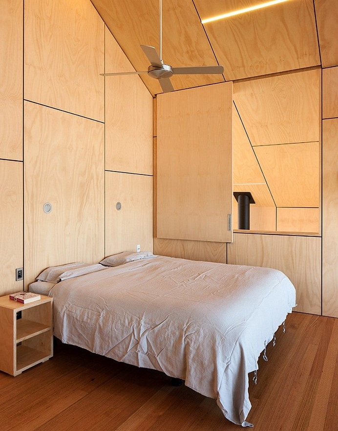 Rusted Steel Cladding House with Crafted Interior Finishes 6