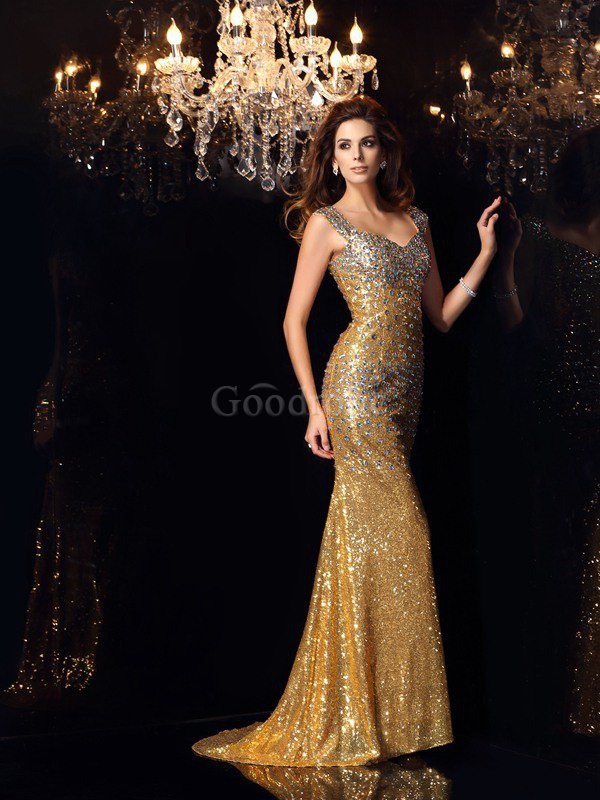 Robe de soirée longue larges bretelles fermeutre eclair en tissu pailleté manche nulle