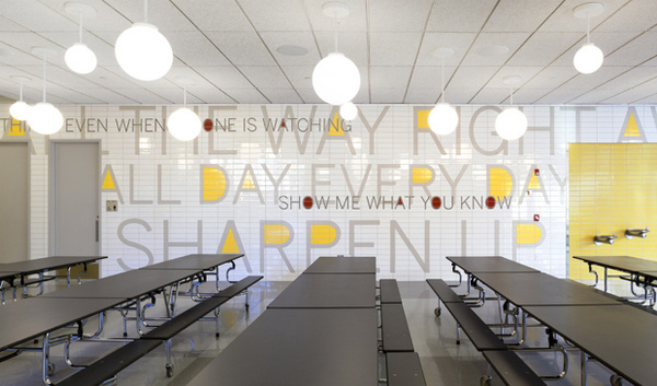 Paula Scher's supergraphics for the PAVE Academy Charter School in Brooklyn include a typographic tile mosaic in the school cafeteria. #environmental #design #graphic #typography