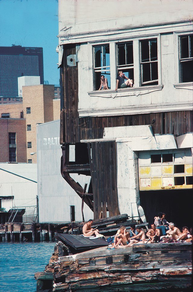 "Sunbathers, Pier 51, Vertical, with Onlookers Above" (1977) by Shelley Seccombe.