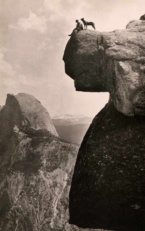 A man and his dog on the Overhanging Rock in Yosemite National Park, May 1924.Photograph by Educational-Bruce Photograph.jpg #white #yosemite #height #black #park #hang #cliff #photography #vintage #and #canyon #dog