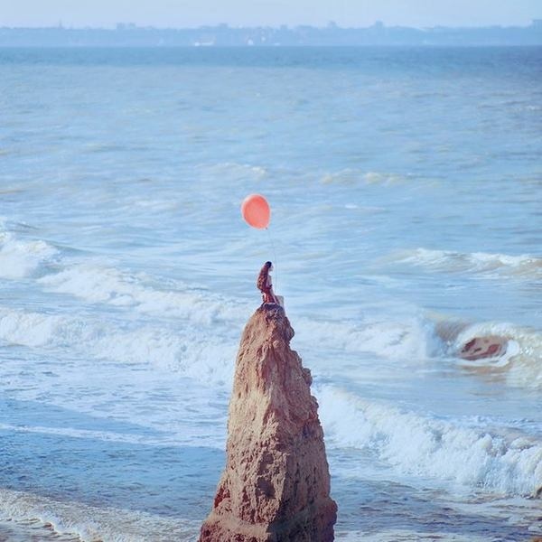 New Surreal Portraits from Oleg Oprisco #girl #photography #ocean #beach #portrait #cold #balloon #long hair