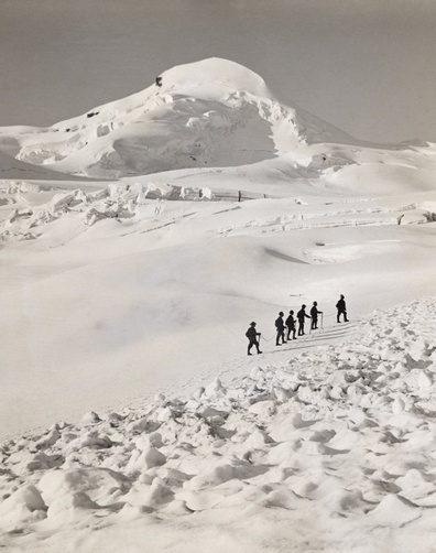 1321115. A group of climbers ascend the Allalinhorn in single file. - NG Stock Photography #mountain #swiss #white #snow #black #photography #and