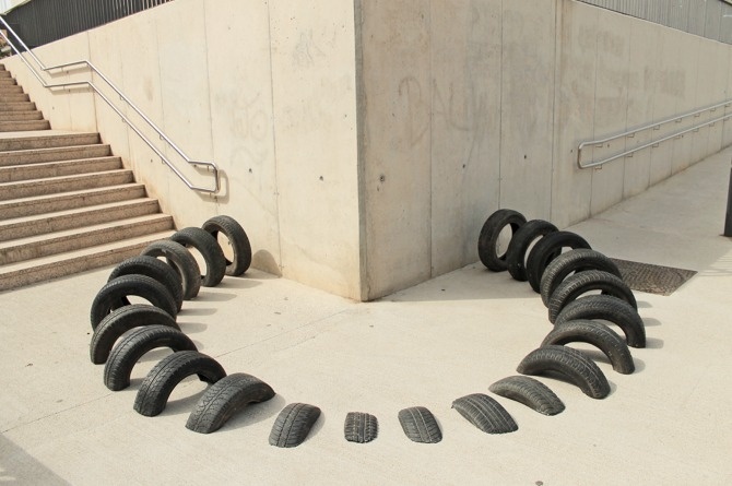 Visual street intervention in Barcelona #urban #visual #iago #geometry #installation #tire #black #mateu #serra #octavi #art #street #ooss