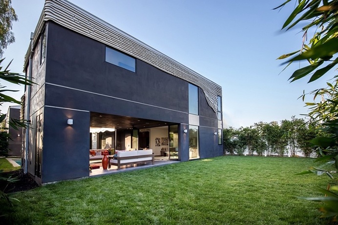 The Wave House by Mario Romano is Encased in White Aluminum