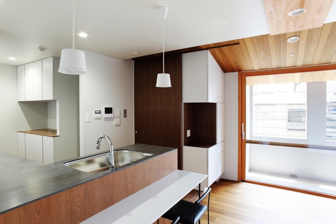House with Added Veranda is a minimalist residence designed by Tokyo-based architects Hiroki Tominaga