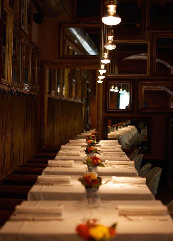 Tables are set with heavy Italian linens.