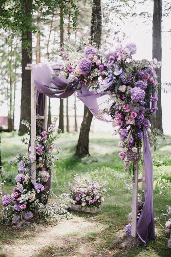 wedding ceremony decorations spring lilac flowers and cloth decorate altar art_petrov via instagram