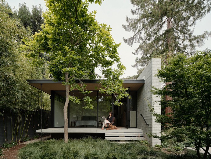 Modern home with Outdoor, Shrubs, Small Patio, Porch, Deck, Concrete Patio, Porch, Deck, Grass, Back Yard, Wood Fences, Wall, Trees, and Hardscapes. Photo 5 of The Sanctuary
