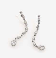 A PAIR OF STUD PIN HANGER IS DECORATED WITH DIAMONDS