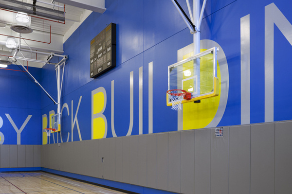 The 7 ft high letters wrap around the walls of the gym. #environmental #design #graphic #typography