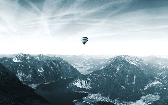 Hot air balloon floating over Hallstatt in the Austrian Alps Photo by: www.mateiplesa.com #balloon #floating #hotair #mountains #lake #maj