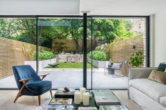"My favorite part of the project are the big glass doors and the skylights. The space honestly has been transformed. We now see the full width of our garden and it feels like it's part of our living space," says Olivia.
