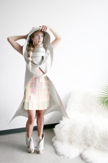 constructed of recycled felt wallcovering and reflective window film materials + inspired by Zaha Hadid's Heydar Aliyev Cultural Center in B #dichroic #model #shoes #cape #zaha #felt #fashion #hood