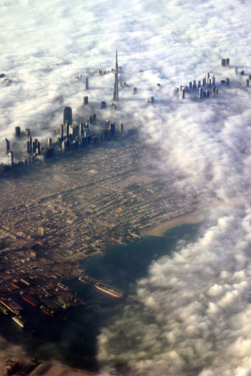 Dubai in the clouds #dubai #clouds #city #skyscraper #desert #photohgraphy