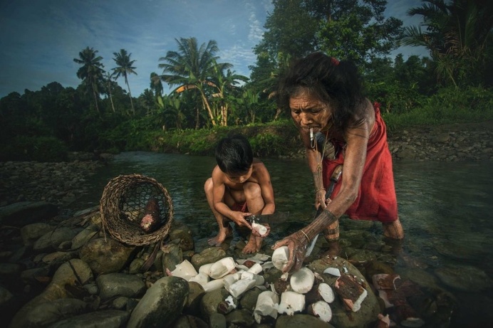 Photographer Documents The Nomadic Life of The Mentawai Tattooed People
