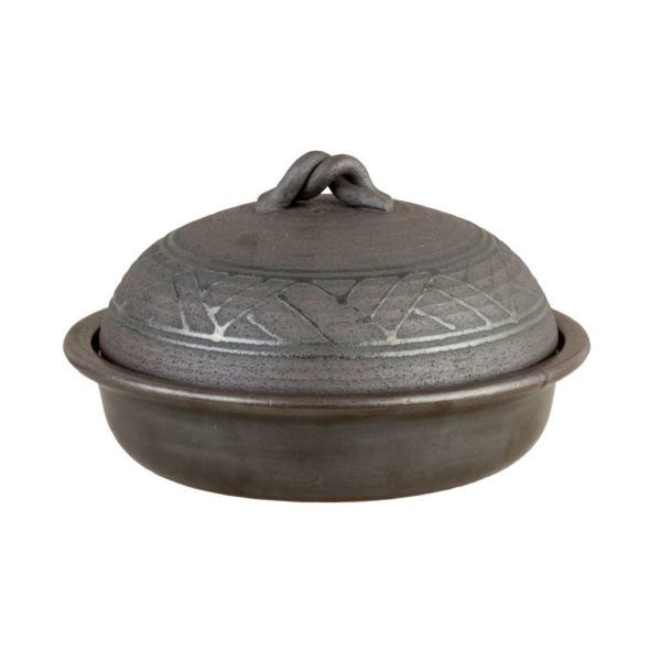 Smoke Pot Donabe The Smoke Donabe Pot is a versatile Japanese hot pot that allows you to steam, bake, and grill! It is a three-in-one pot made out of heat-resistant ceramic clay. It's suitable for use over direct fire, and in the microwave, oven, and dishwasher. Carefully crafted in Japan.
