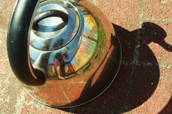 The Tea Kettle Adventures: Reflected Self-Portraits by Esha Biswas