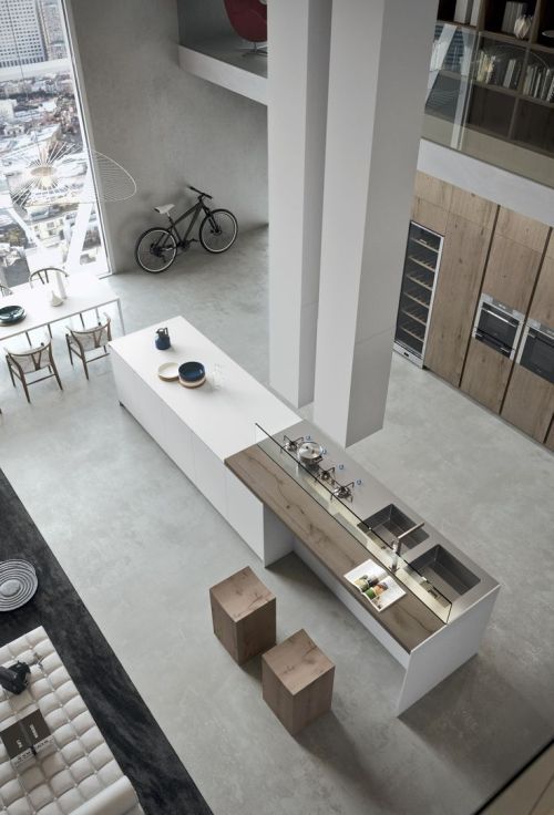 henrycaird: “ Using natural, unpainted wood and neutral grays and whites, the design gives the impression of minimalism while still including plenty of features and furnishings. The Overhead light fixtures spread out like broken umbrellas and serve...