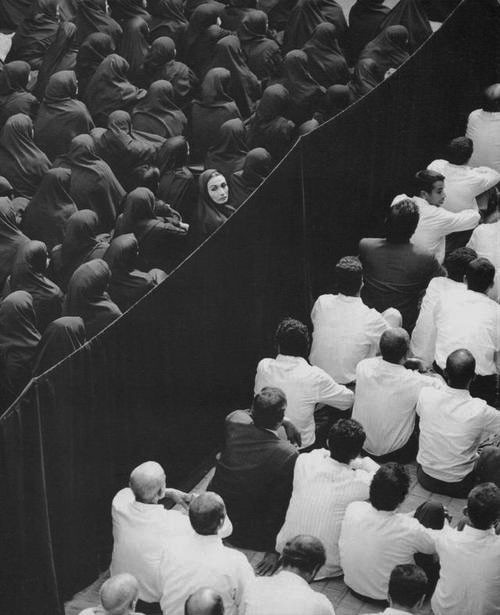Untitled, from Fervor (2000)Shirin NeshatÂ Gelatin silver print #white #woman #divide #crowd #black #photography #prayer #thought #and #lady #audience
