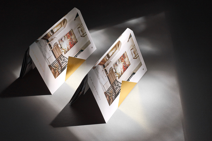 Knoed Creative / 16-page mini brochure with built-in pocket, die cut corners and gold foil stamp. #printdesign #brochure #foilstamp