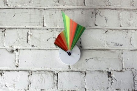 This is a clock made from a printed piece of tyvek. The side edges of the tyvek are the hands the clock. As the time clicks away, the clock #product #design #industrial