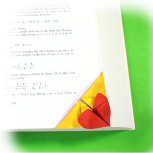 How to make a bottom-corner heart origami bookmark (http://www.origami-make.org/howto-origami-bookmark.php)