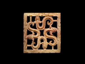 A SQUARE PLAQUE WITH AN OPENWORK PATTERN OF FOUR SNAKES