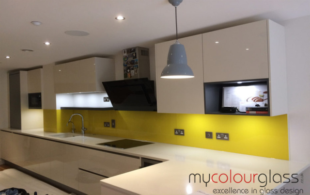 Dulux Banana Dream Kitchen with coloured glass splashback