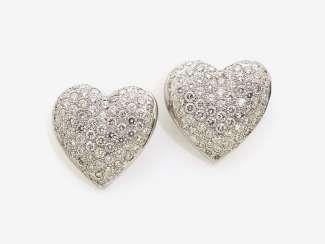 A PAIR OF HEART SHAPED STUD PIN PLUG DECORATED WITH BRILLIANT-CUT DIAMONDS