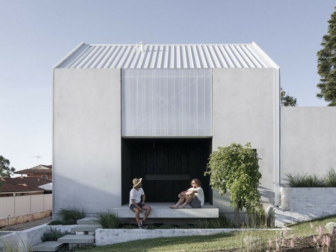 Carbon Neutral House Made from Concrete Panels and Whitewashed Recycled Brick