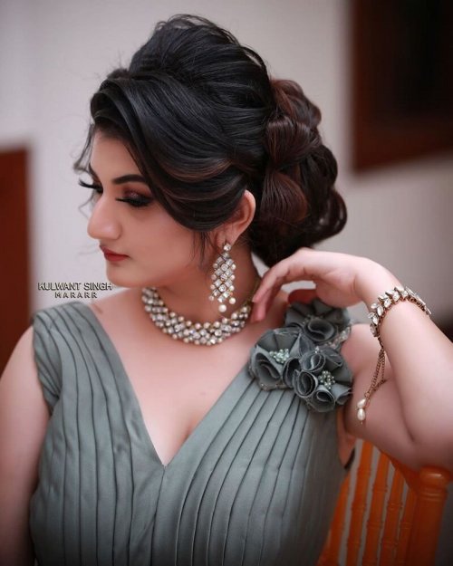 Messy Low Side Hair Bun With Hair Bows
