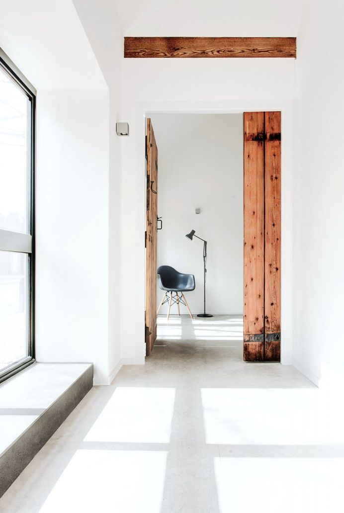 Hallway with old wooden door. The Stables by AR Design Studio. © Martin Gardner. #hallway