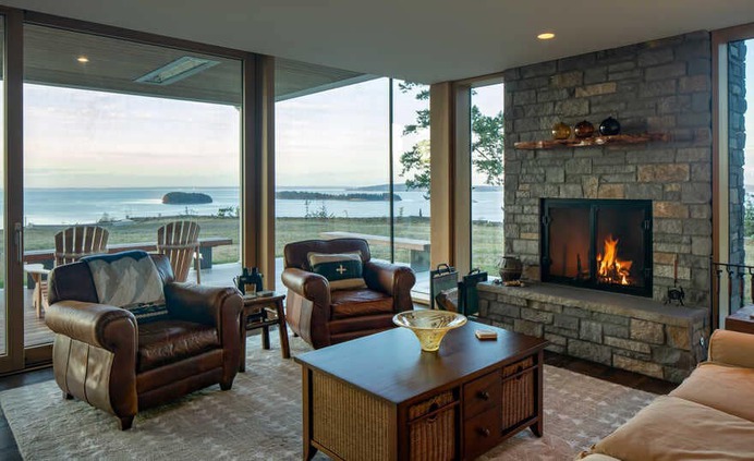 living room, a Renovated Waterfront Retreat by Heliotrope Architects