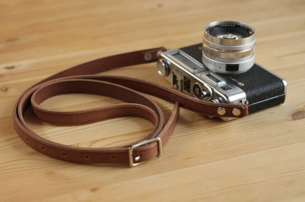 My grandparents Yashica electro 35GSN. I love shooting with this. I recently finished the leather strap for it. #electro #35mm #strap #camera #handmade #leather #yashica