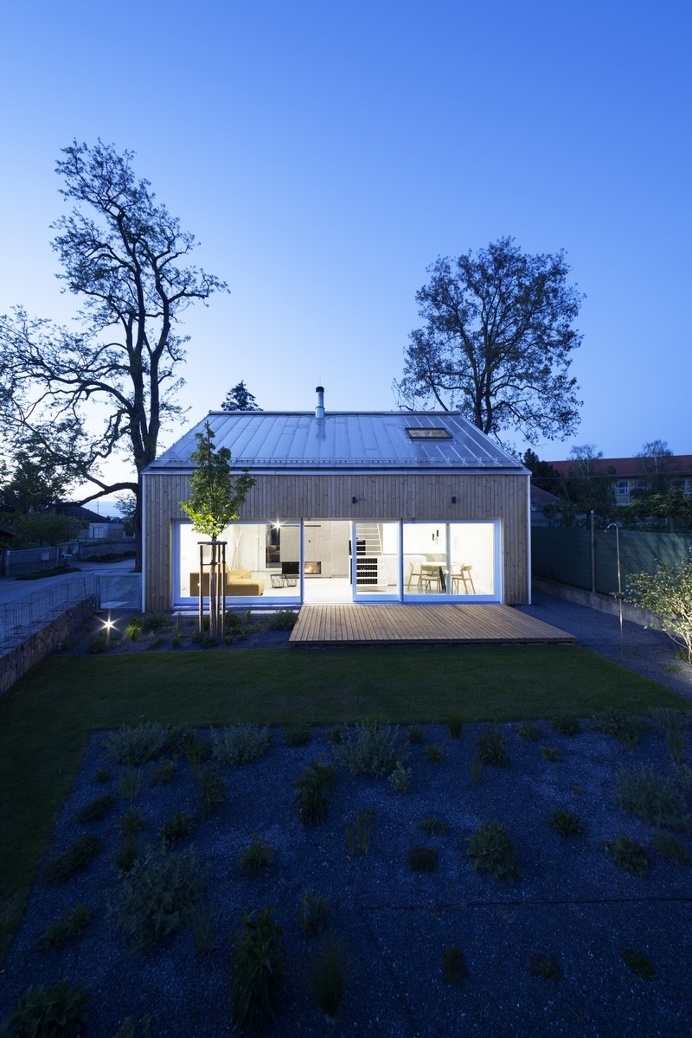 "Under the Calvary" House Has Traditional Shape and Modern Interiors