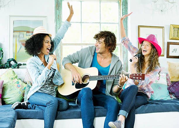 Friends singing and playing music together