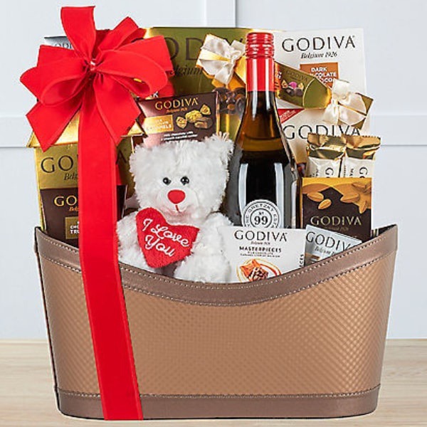 Send Wine Gift Hampers to Canada Free Delivery You can send this amazing wine gift hamper to Canada. Along with wine, it also contains a collection of sweet and delicious Godiva chocolate signature truffles, milk chocolate caramels, chocolate truffle coffee, milk chocolate caramel lion and dark chocolate ganache bars, creme brulee, strawberry cheesecake and chocolate lava cake truffles, dark chocolate hot cocoa and a milk chocolate graham cracker.