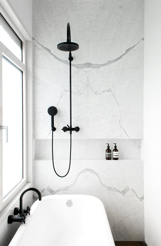 Marble wall with black shower fixtures. JVR Apartment by Dieter Vander Velpen Architects. © Patricia Goijens. #marble #bathroom