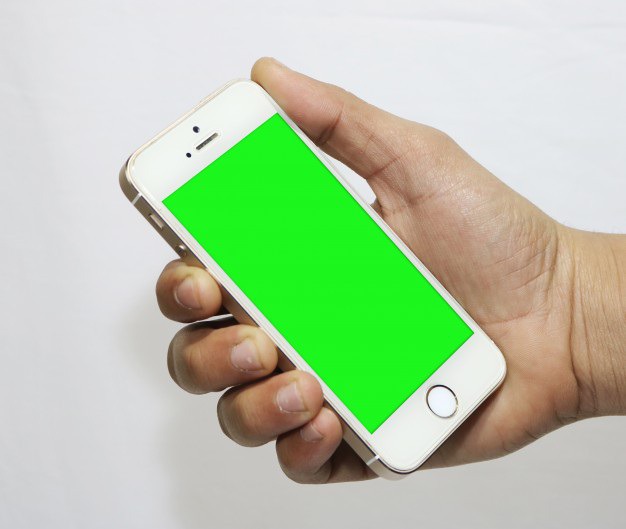 Smartphone with green screen in hand Free Psd. See more inspiration related to Mockup, Computer, Template, Phone, Mobile, Laptop, Web, 3d, Iphone, Corporate, Mock up, Tablet, Company, Display and Screen on Freepik.