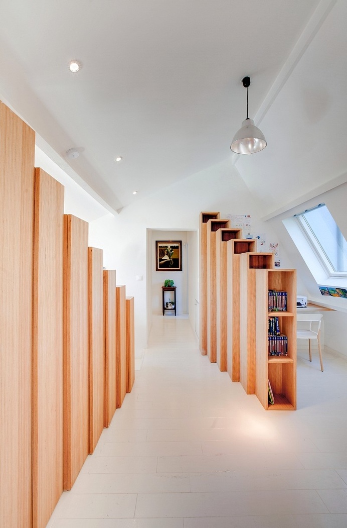 Bookshelf House is an Old House Converted into a Light-Filled Residence