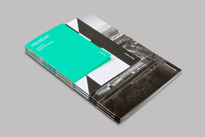 Logo, custom typeface and print with coloured paper and open stitch detail by dn&co. for commercial space Here East #binding #book #cover #layout #editorial