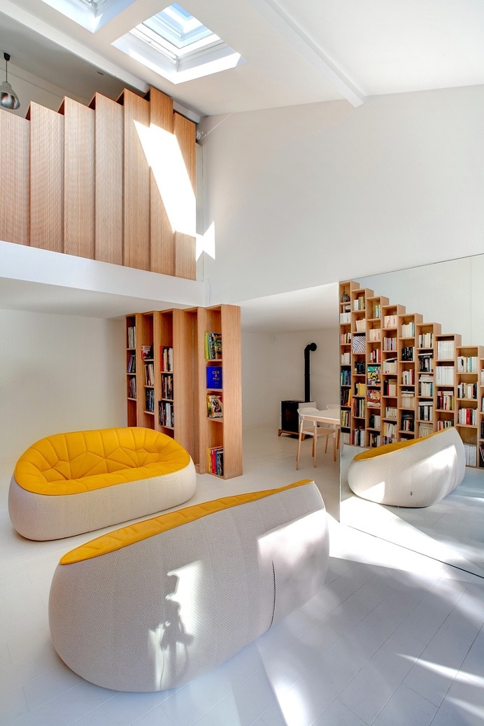 Bookshelf House is an Old House Converted into a Light-Filled Residence