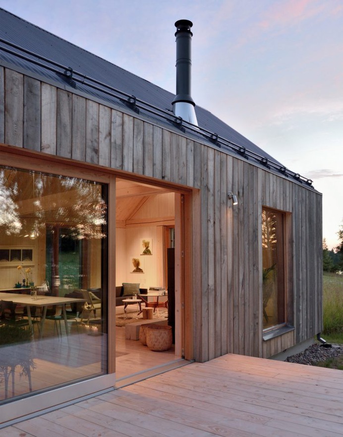 MNy Arkitekter uses seven types of timber for Finnish lake house